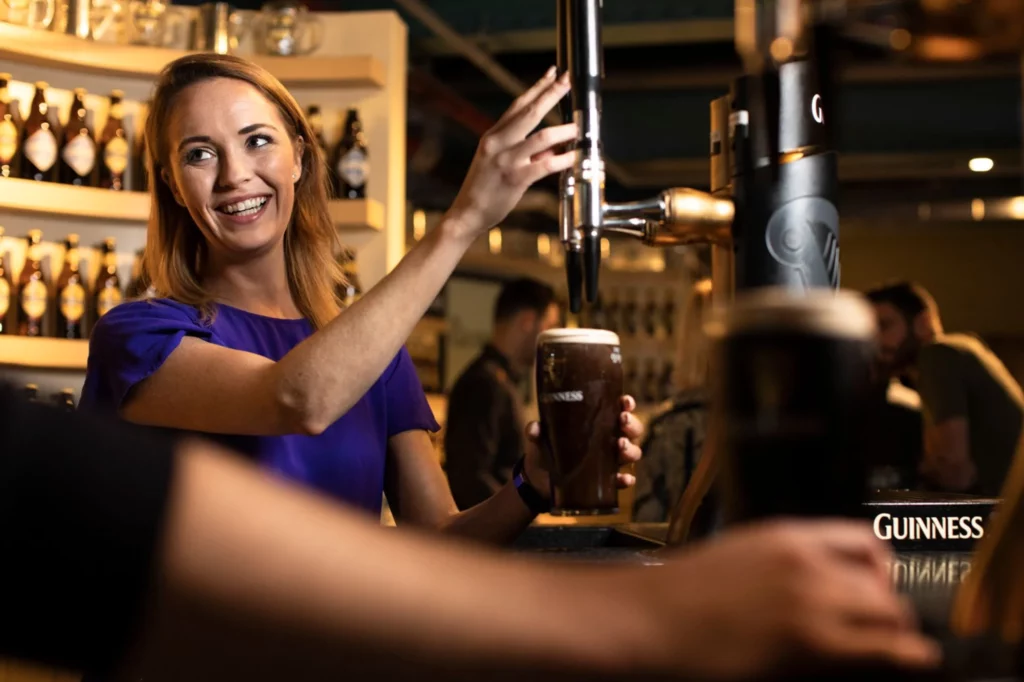 Learning to pour a pint of Guinness at the Guinness Storehouse
