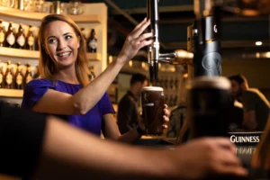 Learning to pour a pint of Guinness at the Guinness Storehouse